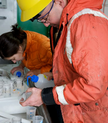 Rob Sherlock and Stephanie Bush extract samples taken by ROV IceCUBE at iceberg C-18A. Photo by Debbie Nail Meyer.