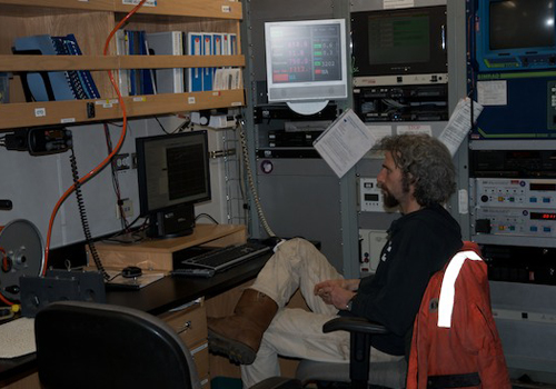 Electronics technician Dan Elsberg runs the data acquisition software during a CTD rosette deployment. Photo by Debbie Nail Meyer.