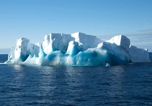 A small iceberg with old blue ice that was chosen for an ROV dive. Photo by Debbie Nail Meyer.