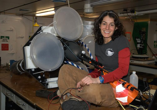 Engineer Alana Sherman rebuilds a Lagrangian sediment trap between deployments. Photo by Debbie Nail Meyer.