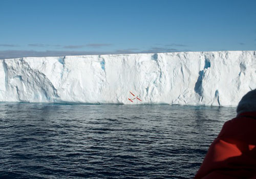A remote-controlled airplane delivers a GPS tag to an iceberg under study in the Weddell Sea.