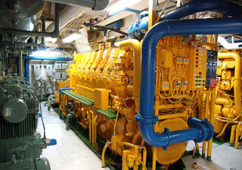 One of four 8-cylinder diesel engines powering the ship. Two engines are connected to each shaft and propeller. Credit: Johnny Pierce.