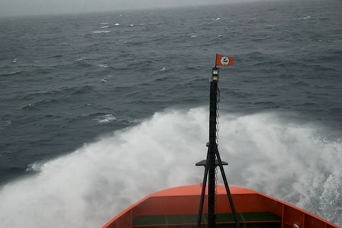Waves break over the bow of the RVIB Nathaniel B. Palmer as it crosses the Drake Passage. Photo by Debbie Nail Meyer.
