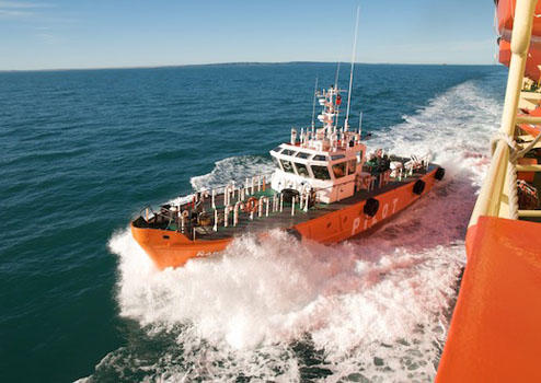 A pilot boat transfers a pilot onboard the Palmer. The pilot assists the bridge with navigation through the local waterways. Photo by Debbie Nail Meyer.