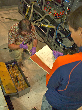 Jake Ellena and Crissy Huffard prepare water samples brought up by ROV Doc Ricketts for oxygen analysis. Photo: Carola Buchner.