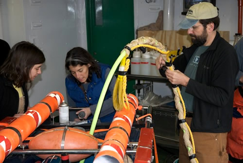 Stephanie Bush, Alana Sherman, & Paul McGill ready ROV IceCUBE for deployment.