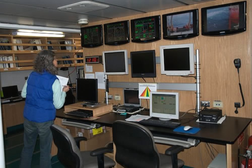 Maria Vernet checks data in the dry lab. Photo by Debbie Nail Meyer.