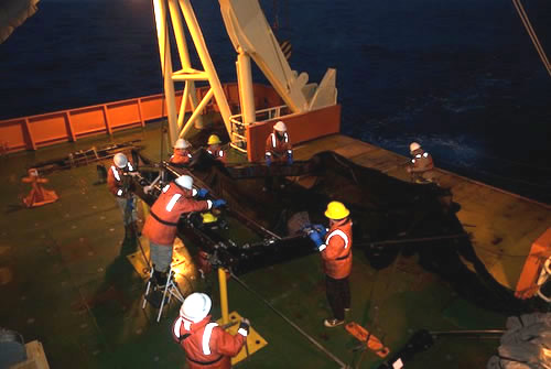 MOCNESS recovery by the Kaufmann team (Larry Lovell, Dani Garcia, Mike Fox, Stephanie Bush, Rob Sherlock) with marine techs Randy Sliester and Chance Miller. Photo by Debbie Nail Meyer.