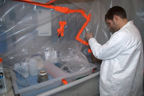 Ben Twining fills water samples in the