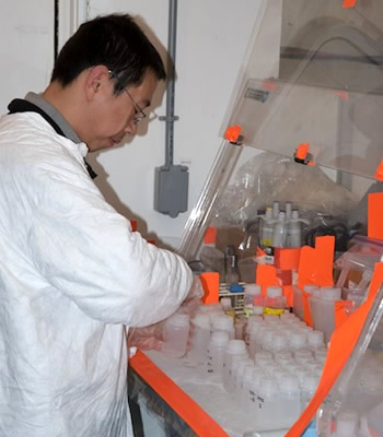 Graduate student Hai Lin processes iron samples in the trace metal van. Photo by Debbie Nail Meyer.