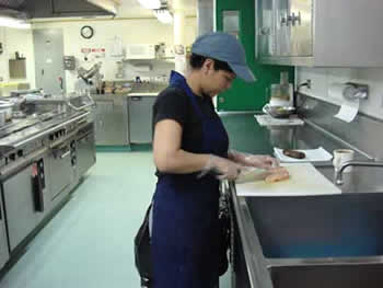 Cook Alejandra Monje Miranda prepares dinner for all 70 people on the Palmer. Photo by Amanda Kahn.