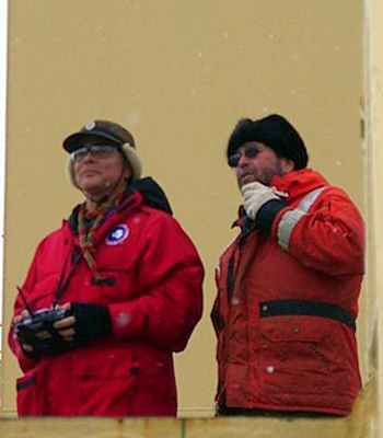 Kim Reisenbichler flew a successful UAV mission today while wearing the lucky aviator scarf his daughter, Sarah, wove for him before he left. To his right is co-pilot Craig Dawe. Photo by Lindsey Eckern.