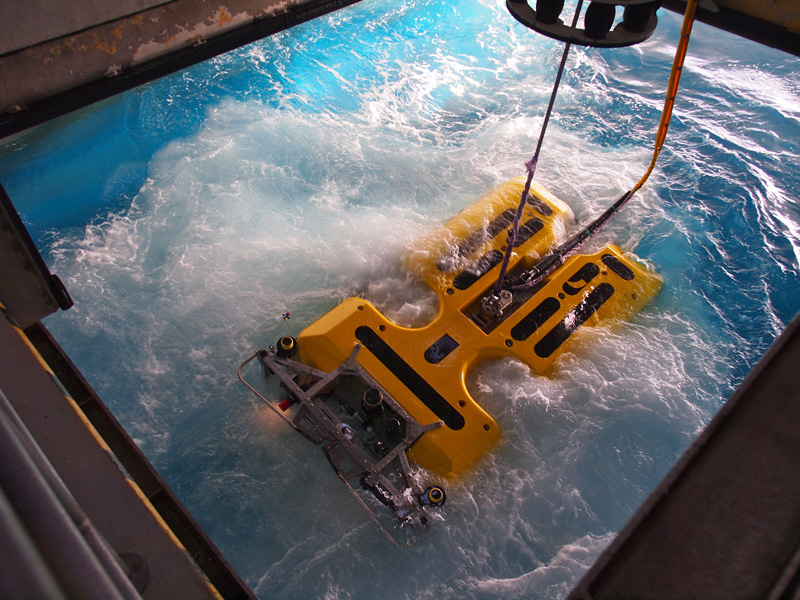 ROV Doc Ricketts heads into the water to release the weights holding the elevator down at the seafloor. With the weights released, the elevator drifted up to the surface, ready to be recovered. Photo: Carola Buchner.
