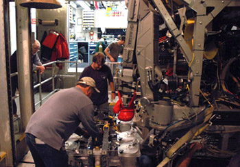 Kim Reisenbichler and Randy Prickett install the Midwater Respirometry System (MRS) on ROV Doc Ricketts.
