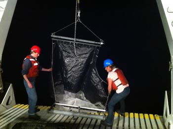 Meghan Powers and Warren Francis deploy the tucker trawl.