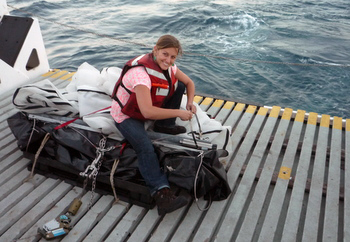 Meghan Powers prepares the trawl equipment.