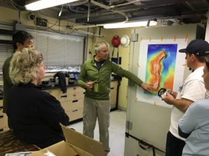 Dr. Jim Barry of MBARI briefs the science crew on the first-day's dive plan at Sur Ridge. (Photo: Andrew DeVogelaere, NOAA/MBNMS)