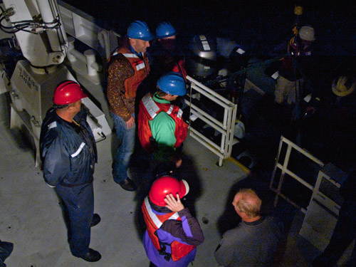 Henk-Jan Hoving, Bret Grasse, and Lisa Uttal prepare for an at-sea departure from the Western Flyer.