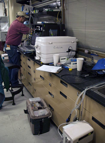 Kim Reisenbichler working on the laboratory respirometry setup on board the Western Flyer.