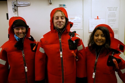 Olivia Judson, Zach Kobrinsky, and Danielle Haddock try on their immersion suits. Safety first!