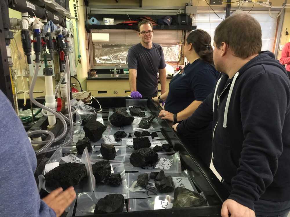 Brian talks about the lava samples we collected today with grad students Beth and Charles.