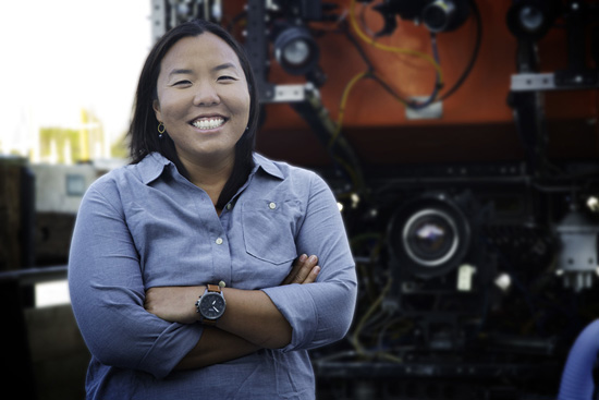 Postdoctoral Fellow Anela Choy standing in front of MBARI's remotely operated vehicle Ventana. Image courtesy of L'Oreal.