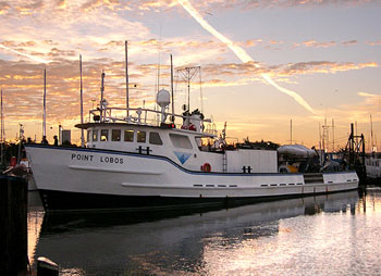 The research vessel Point Lobos heads away from the dock at dawn to spend another long day out on Monterey Bay. Image: Johnny Ferreira (c) 2006 MBARI