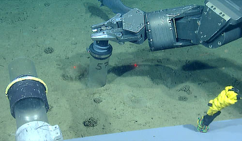 This photo shows the manipulator arm on the ROV Doc Ricketts inserting a