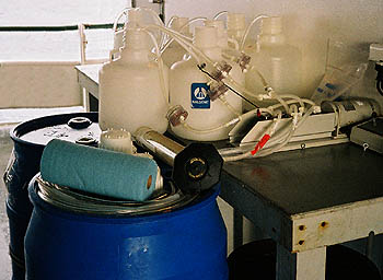  In order to obtain enough DNA for this study, Preston had to process seawater samples using 55-gallon barrels and high-volume electric pumps instead of traditional laboratory equipment such as beakers and pipettes. Image: Lynne Christianson (c) 2002 MBARI