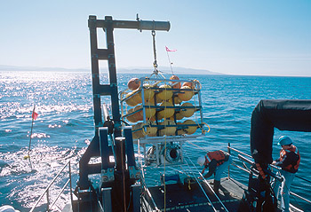 Deploying the fish trap in Monterey Bay using the J-frame on MBARI's research vessel Zephyr. Photo: Todd Walsh (c) 2004 MBARI