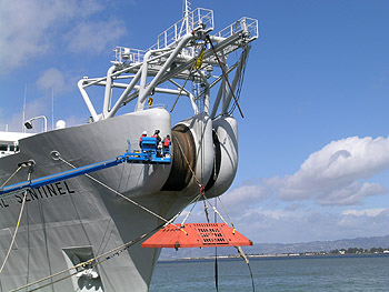 After laying the MARS observatory cable, the cable-laying ship Global Sentinel went to San Francisco Harbor pick up the trawl-resistant frame (orange object at bow of ship) that will protect the electronic