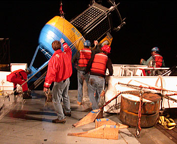 The buoy for the new MOOS test mooring was deployed before dawn. This allowed plenty of time for the delicate job of deploying the mooring cable before the wind picked up in the afternoon. Photo: Mark Chaffey