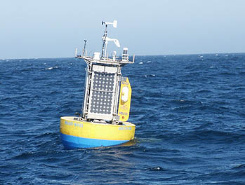 The MTM3 mooring rides the afternoon wind waves off Monterey Bay. Solar panels on all four sides of the buoy will provide electrical power for a variety of scientific and engineering instruments. Photo: Norman Farr