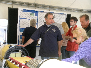 AUV technician Duane Thompson explains how an autonomous underwater vehicle (AUV) can find its way unassisted in Monterey Canyon. Photo: Kim Fulton-Bennett (c) 2004 MBARI