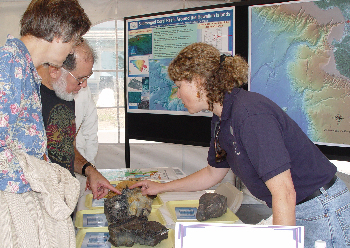 Geologist Jenny Paduan describes lava samples from the seafloor. Photo: Kim Fulton-Bennett (c) 2004 MBARI