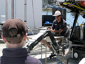 Remotely operated vehicle (ROV) pilot Mark Talkovic demonstrates the dexterity of ROV Ventana's manipulator arm. Photo: Duane Thompson (c) 2007 MBARI
