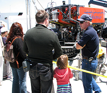 Knute Brekke, who pilots MBARI's remotely operated vehicle (ROV) Ventana, explains how a full-sized ROV works to visitors on MBARI's dock. Photo: Duane Thompson (c) 2007 MBARI