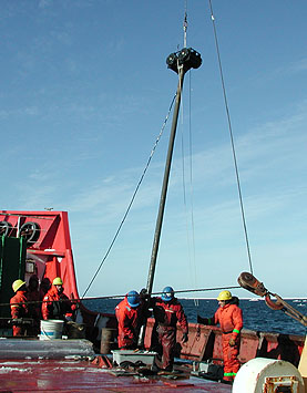 Sediment cores collected from the floor of the Arctic Ocean helped the research team understand more about the history of this remote ocean basin. The snow on the deck of the ship is a reminder of the challenges that scientists face in Arctic research. Image: (c) 2003 Charlie Paull