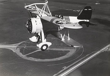 Sparrowhawk biplanes such as this one were stored in the USS Macon’s hangar deck. They were released via a trapeze and a harness that lowered the planes through a T-shaped opening in the airship's underside. When returning to the airship, the Sparrowhawk pilots had to match their speed to that of the ship and catch the trapeze with a hook at the top of the plane. Because of their landing technique, the Sparrowhawk pilots were known as “the men on the flying trapeze.” Credit: Wiley Collection, Monterey Maritime & History Museum