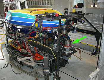  For this expedition, ROV Tiburon will be rigged with custom-made light booms and a downward-pointing, high-resolution camera (green arrow). This equipment will be used, along with a precision ROV-control system developed at Stanford University, to produce large-scale photo-mosaic images of the seafloor and the wreck site. Image: Chris Grech (c) 2006 MBARI