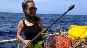 Jacki Long holding an underway CTD on the R/V Endeavor while in the North Atlantic Ocean.