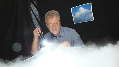 photo of Stephen Borrmann experimenting with water and ice