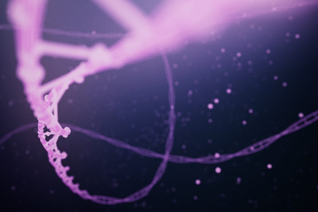 A screenshot from a computer animation shows the double helix structure of several pink threads of DNA.